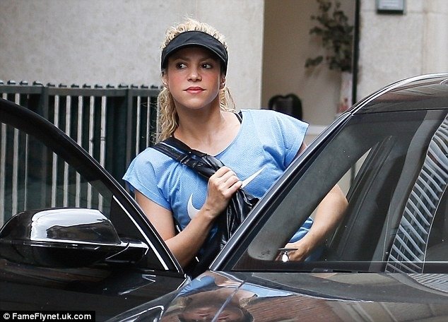 Let’s get physical! Shakira cuts an athletic figure as she arrives to a Barcelona gym in short-shorts and sporty visor