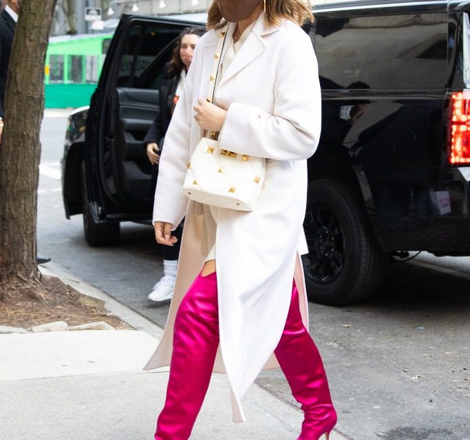 Chrissy Teigen Looks Like a Winter Barbie Doll in Timeless White Coat and the Most Electrifying Pink Boots